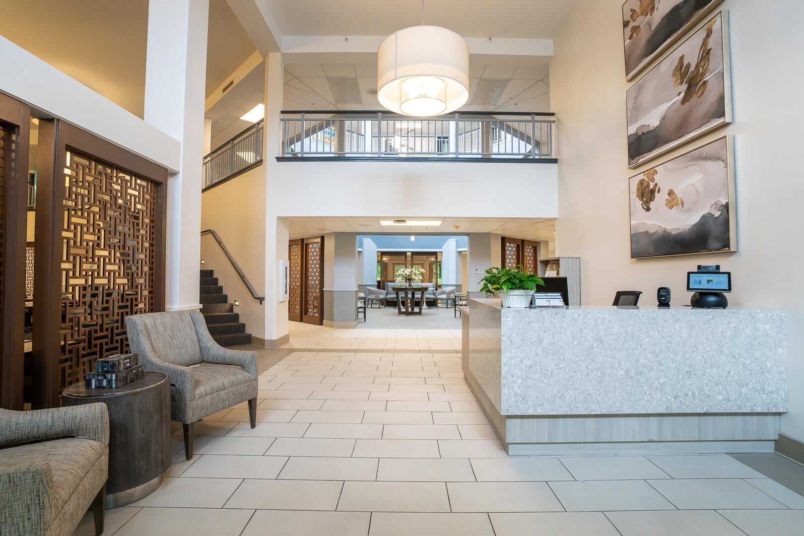 Elegant Reception Lobby With Marble Counters at Senior Living Facilities