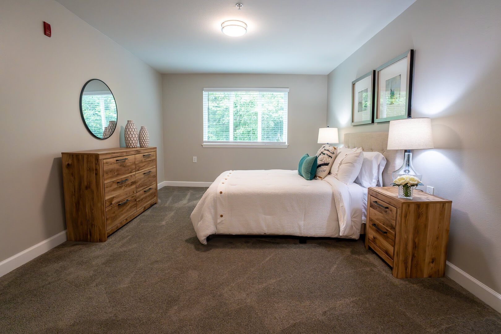 Private Bedroom With Wood Furnishings at Senior Living Apartments