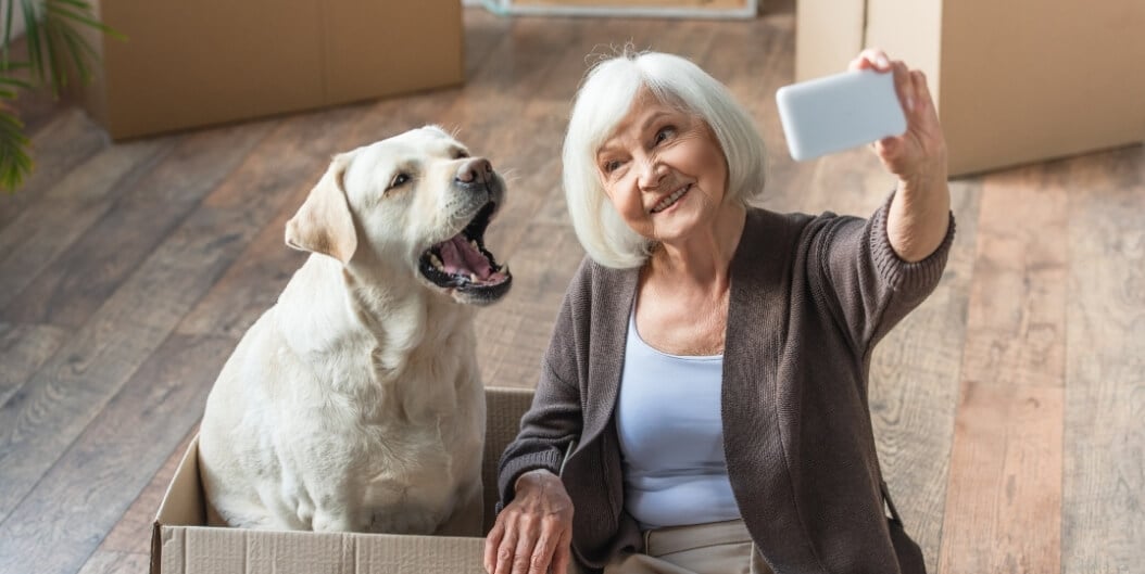 Elderly Woman Taking a Selfie with Her Dog at an Independent Living Facility