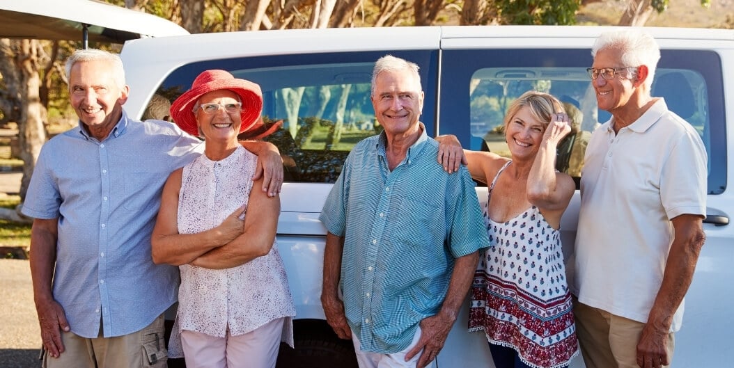 Elderly Friends Boarding Shuttle Van at Independent Living Facility